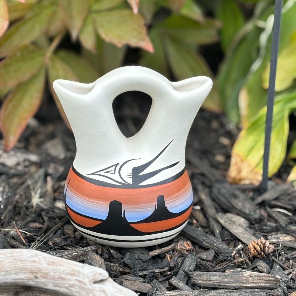 Native American wedding vase form, with two spouts joined by a central handle.